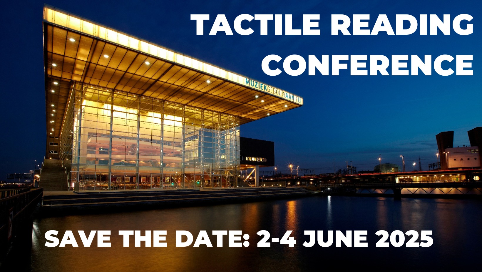 Een verlicht Muziekgebouw aan ’t IJ bij nacht. Tactile Reading Conference, save the date: 2-4 June 2025